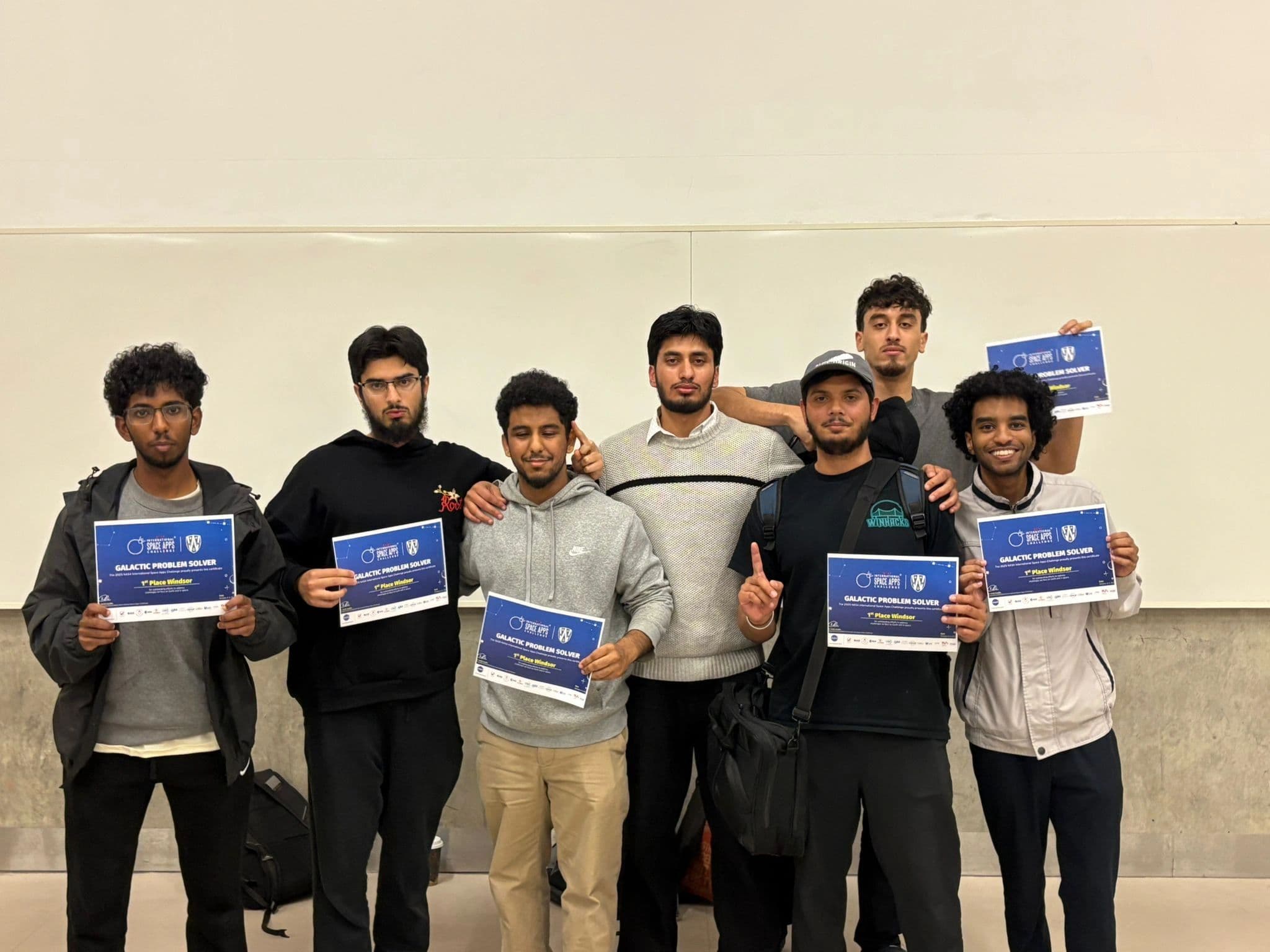 Team holding 1st Place Windsor certificates at the NASA Space Apps Challenge