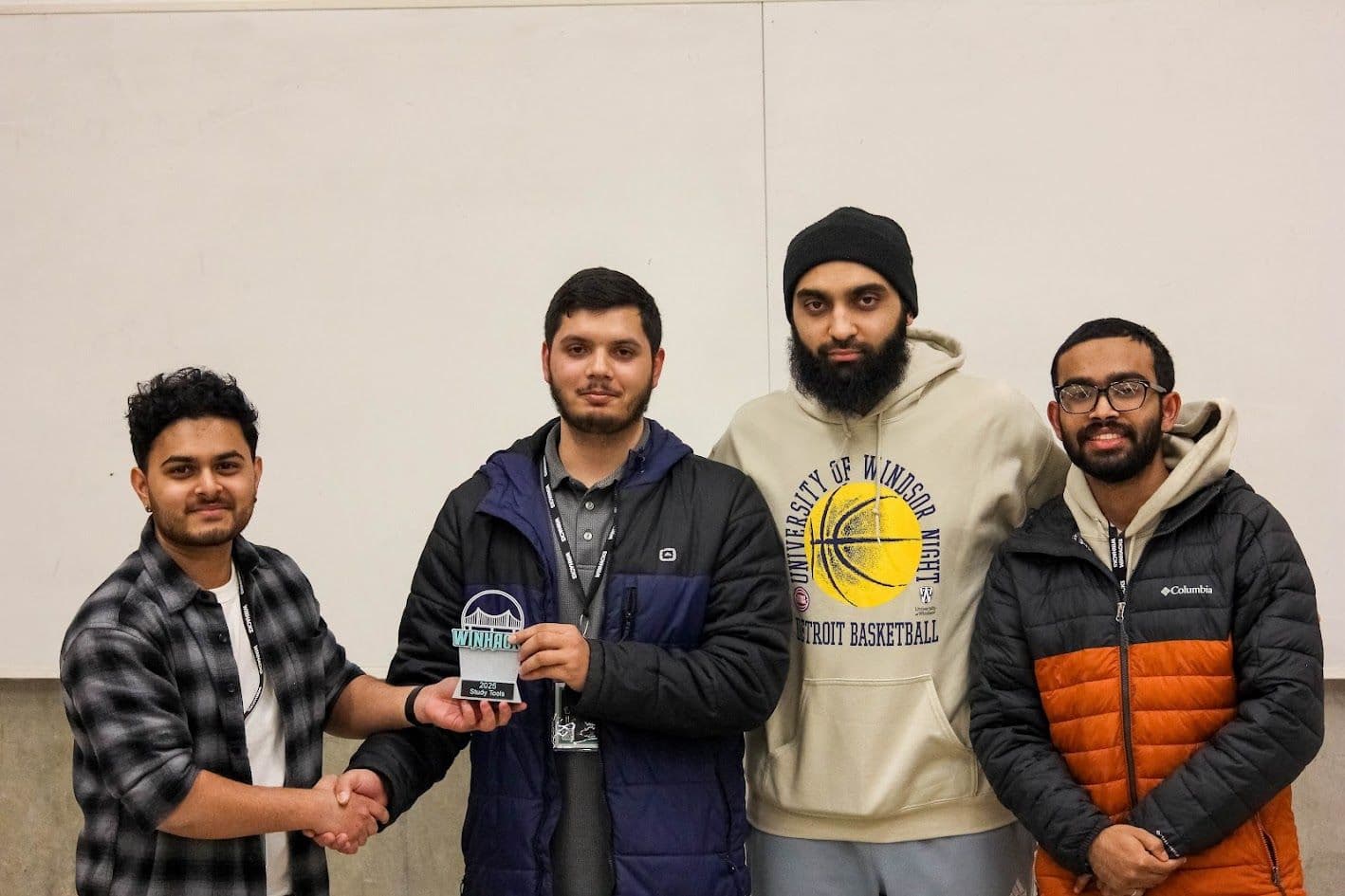 Accepting the award at WinHacks 2025